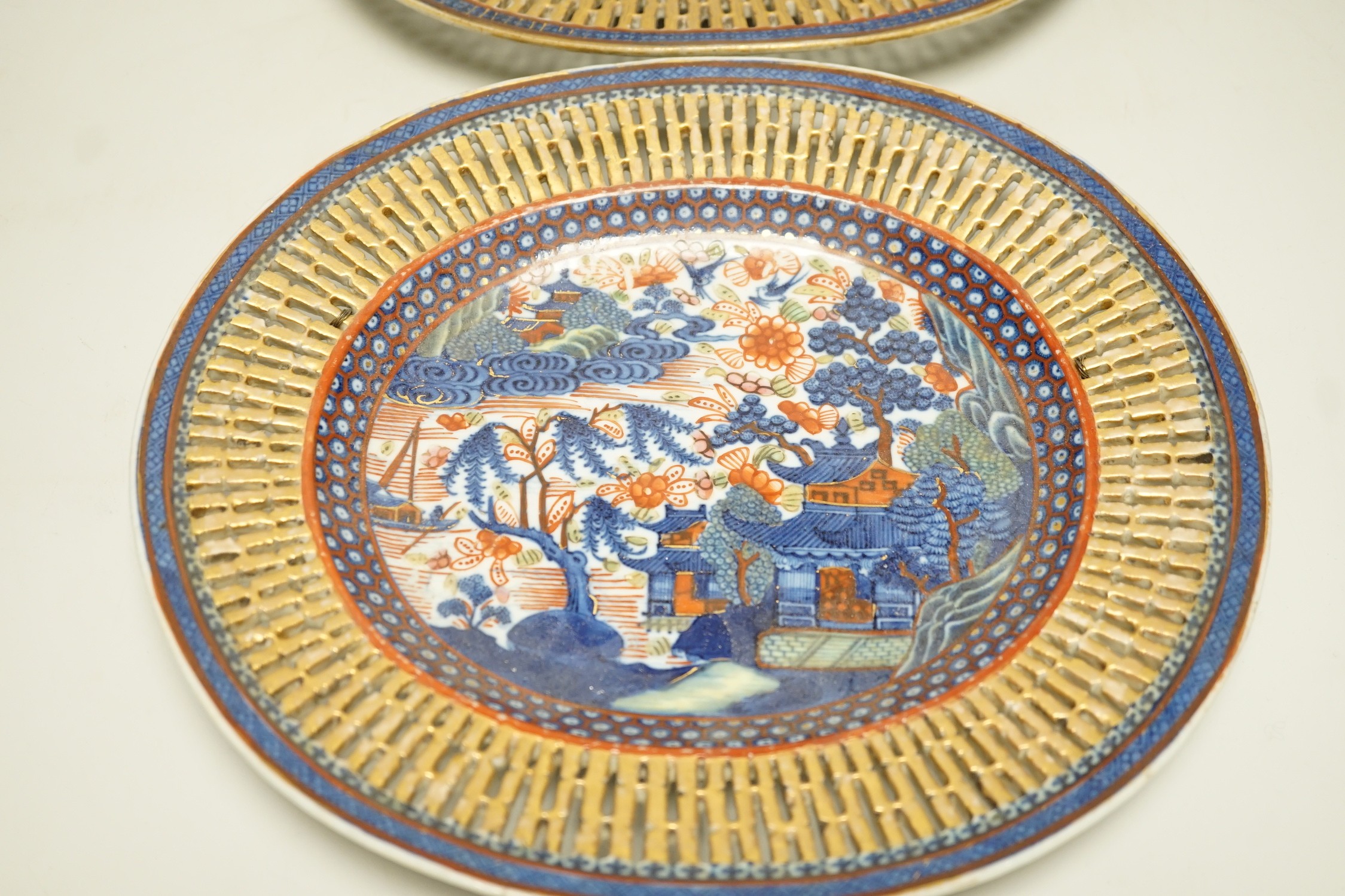 A pair of late 18th century Chinese chestnut basket stands with Dutch over enamelled decoration, 27.5cm
